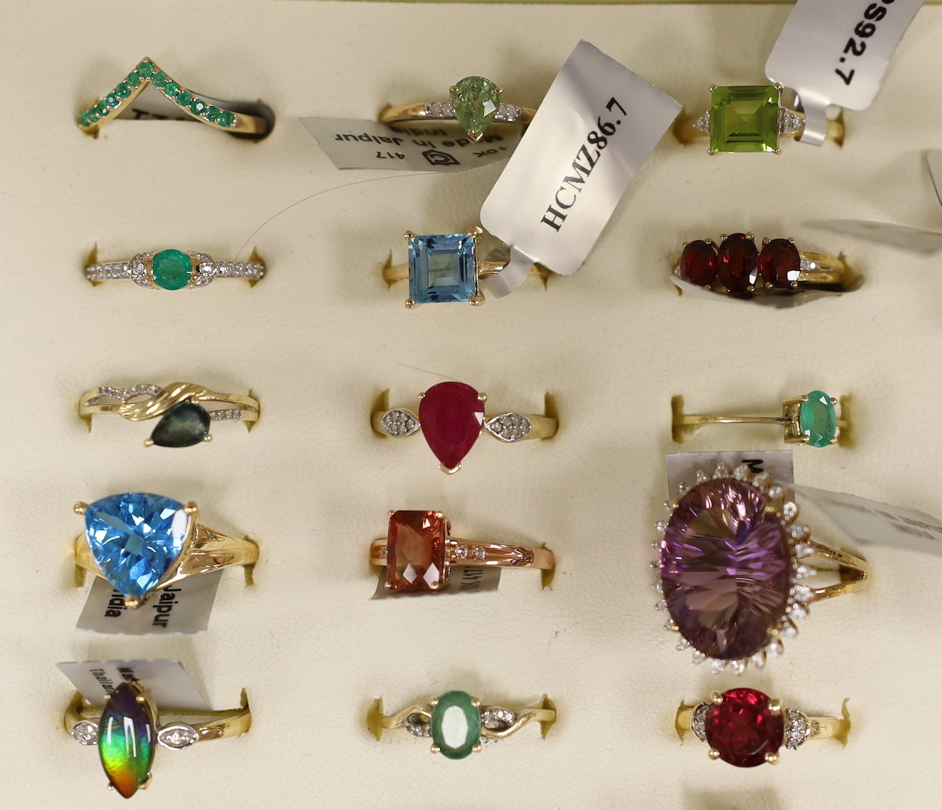 Forty three assorted modern 9ct gold and gen set dress rings including amethyst, emerald and garnet, one 18ct gold and gem set ring and six assorted 925 rings, in ring box.